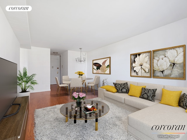 living room with a chandelier and hardwood / wood-style flooring