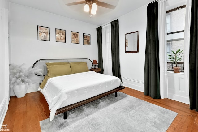 bedroom featuring ceiling fan and wood-type flooring