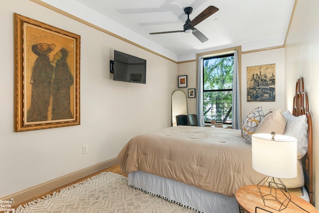 bedroom with light hardwood / wood-style flooring and ceiling fan