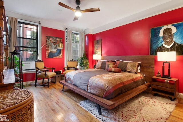 bedroom featuring hardwood / wood-style floors and ceiling fan