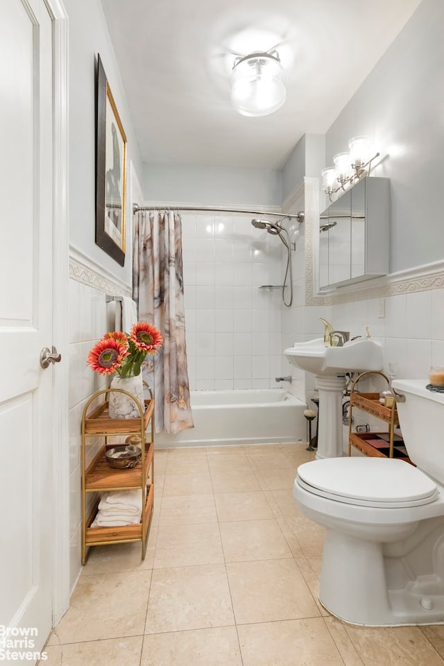 full bathroom with toilet, tile patterned flooring, shower / tub combo, sink, and tile walls