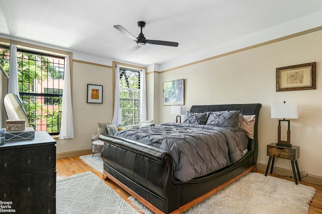 bedroom featuring ceiling fan and light hardwood / wood-style flooring