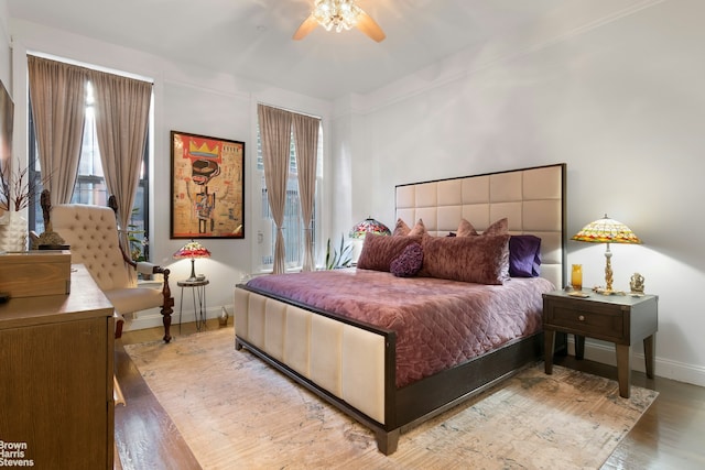 bedroom featuring light wood-type flooring and ceiling fan