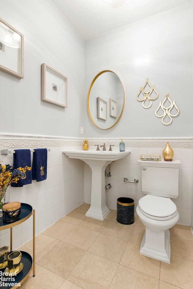 bathroom featuring tile walls, toilet, and tile patterned flooring