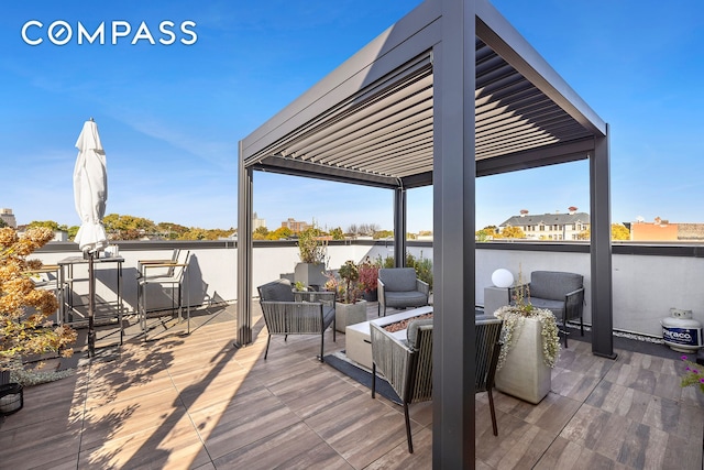 view of patio with an outdoor fire pit, area for grilling, and a water view