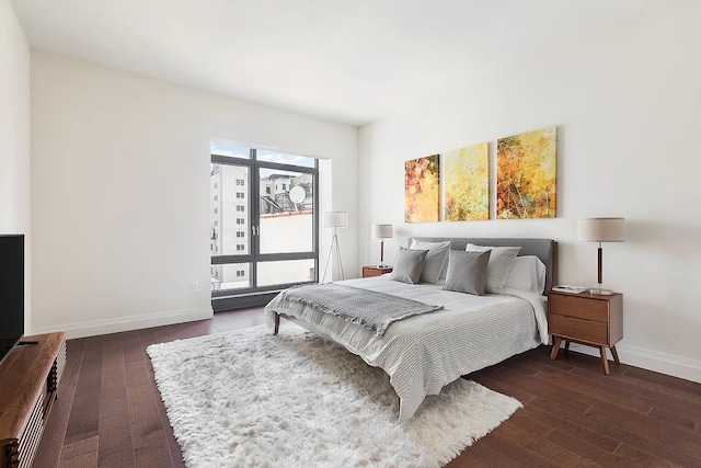 bedroom featuring dark hardwood / wood-style flooring