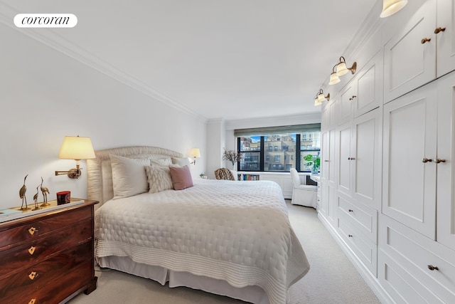 bedroom with light carpet, crown molding, and a closet