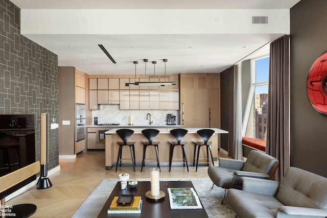 living room featuring sink and light parquet flooring