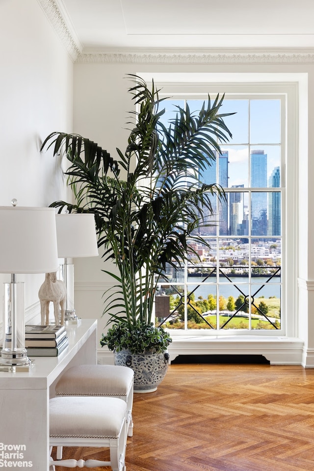 room details featuring parquet flooring and ornamental molding