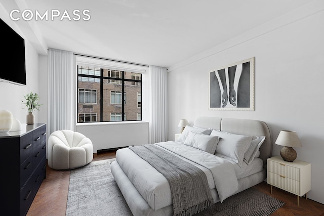 bedroom featuring dark hardwood / wood-style floors