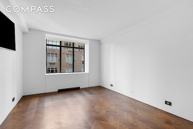 empty room featuring dark parquet floors