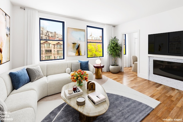 living room featuring a wealth of natural light and hardwood / wood-style floors