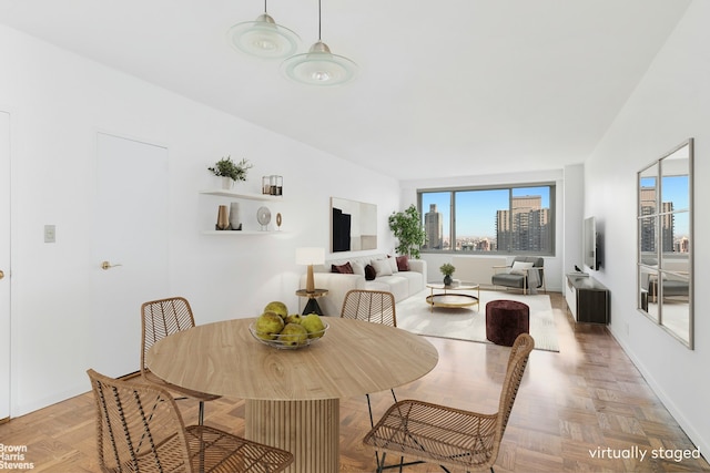 dining room featuring light parquet flooring