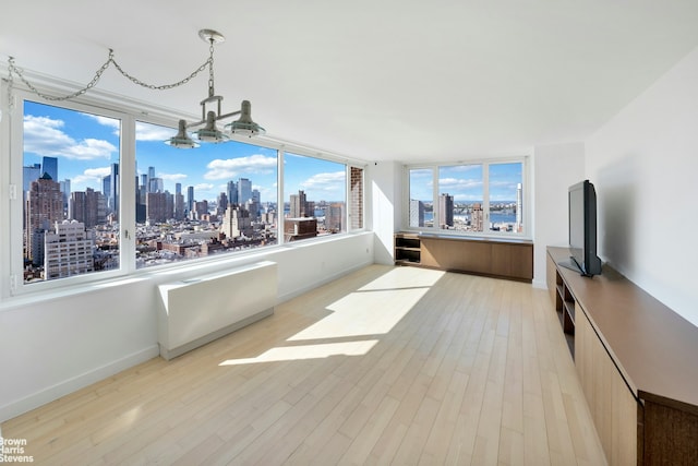 interior space featuring a notable chandelier and a wealth of natural light