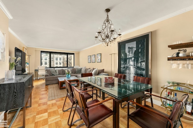 dining room featuring an inviting chandelier, crown molding, and light parquet floors