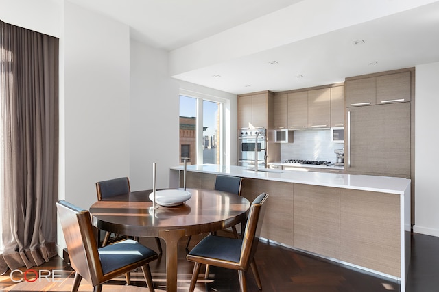 dining area with dark wood-type flooring