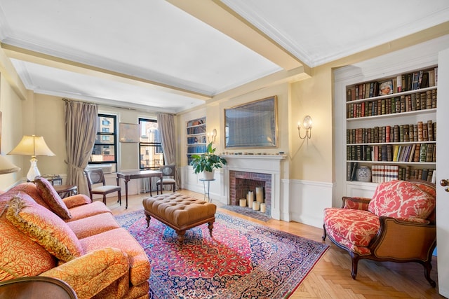 living room with built in features, parquet floors, ornamental molding, and a brick fireplace