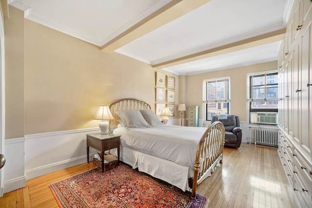 bedroom featuring radiator heating unit, light hardwood / wood-style flooring, cooling unit, and crown molding