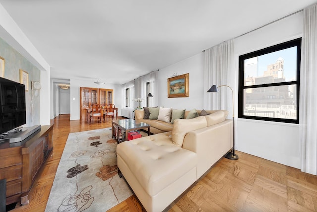 living room featuring light parquet floors