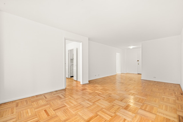 spare room with light parquet floors