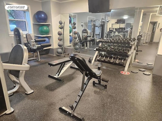 workout area with crown molding