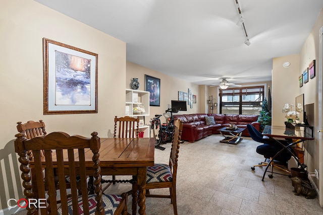 dining room with rail lighting and ceiling fan