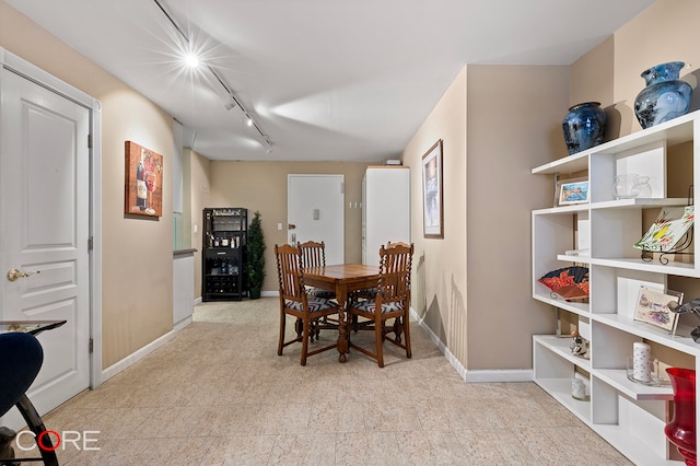 dining space featuring track lighting