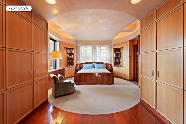 bedroom with hardwood / wood-style floors