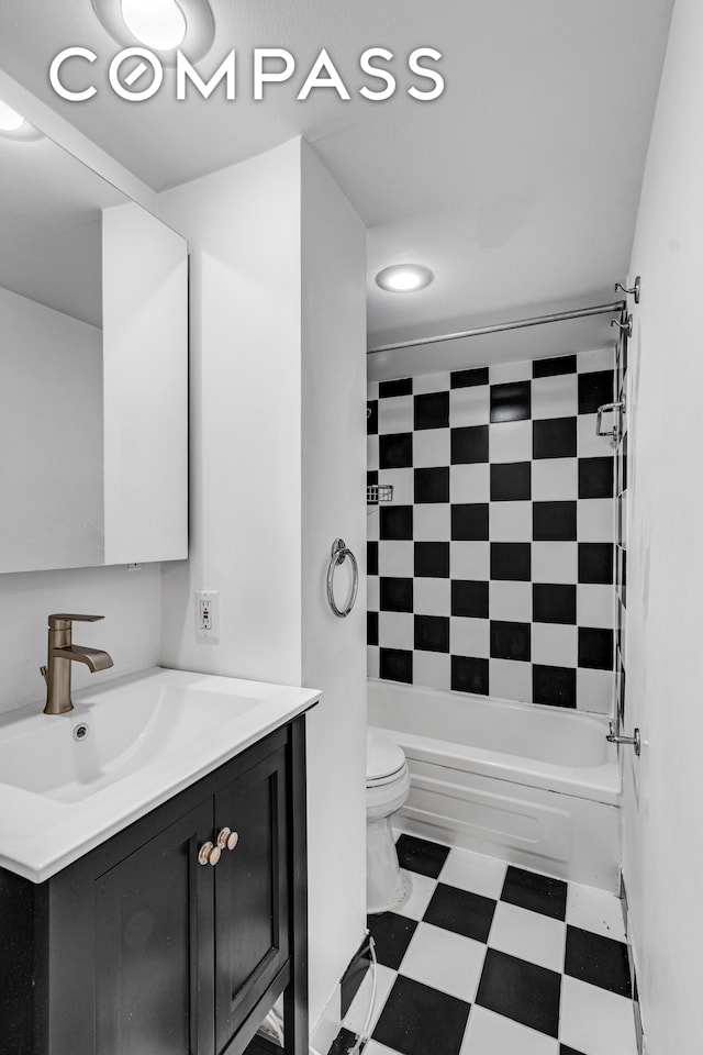 full bathroom featuring toilet, vanity, and shower / bathtub combination