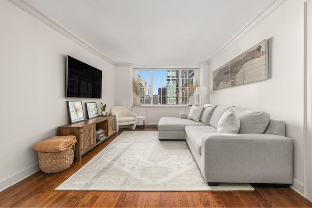 living room featuring hardwood / wood-style flooring and ornamental molding