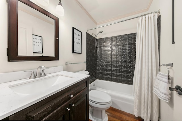 full bathroom featuring wood-type flooring, toilet, ornamental molding, vanity, and shower / bath combination with curtain