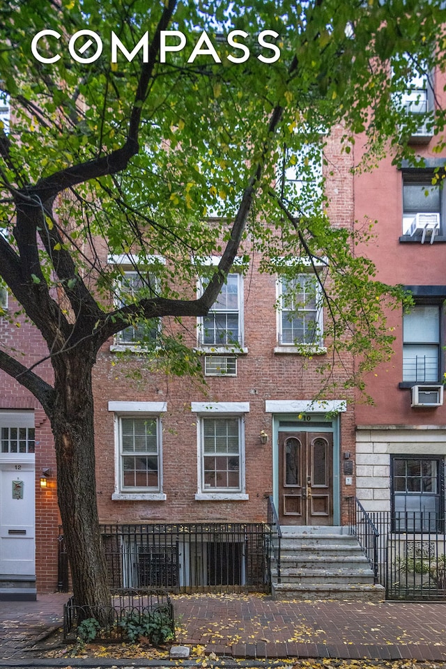 view of front of property with cooling unit