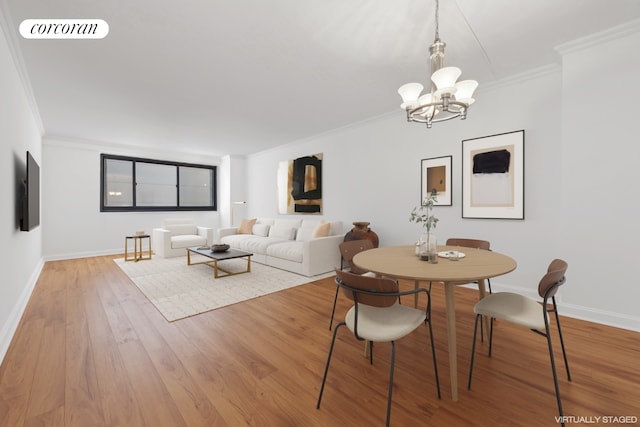 dining space with an inviting chandelier, ornamental molding, and hardwood / wood-style flooring