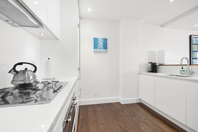 kitchen featuring white cabinetry, black gas stovetop, sink, and dark hardwood / wood-style floors