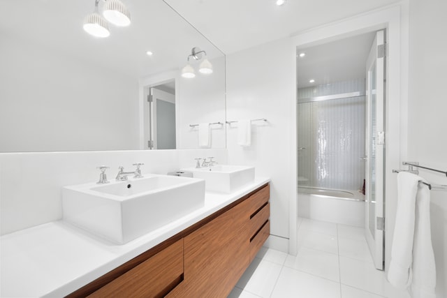 bathroom featuring shower / bath combination with glass door, tile patterned flooring, and vanity