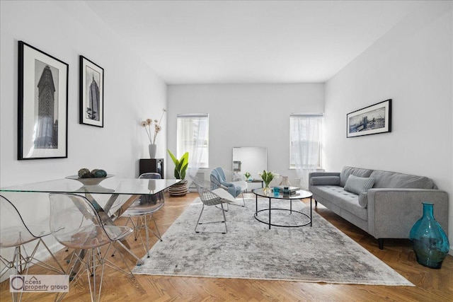 living room featuring parquet floors