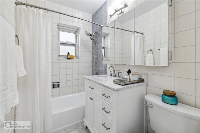 full bathroom with toilet, decorative backsplash, shower / bath combo with shower curtain, vanity, and tile walls