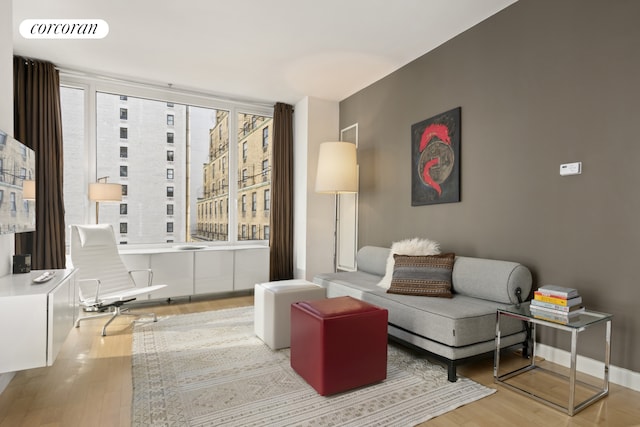 living area featuring hardwood / wood-style floors