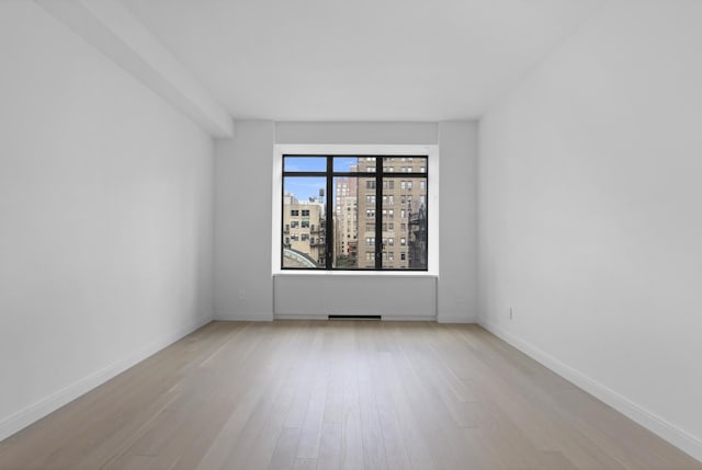 empty room featuring light hardwood / wood-style floors