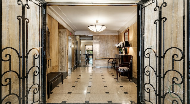 hallway with wooden walls and crown molding