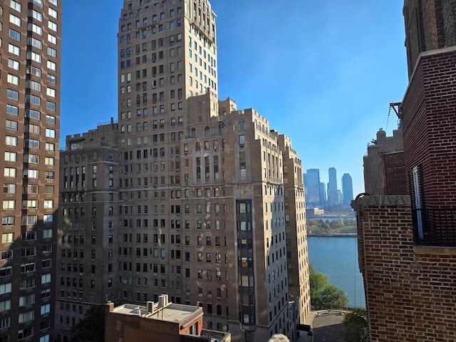 property's view of city featuring a water view