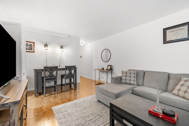 living room featuring parquet flooring