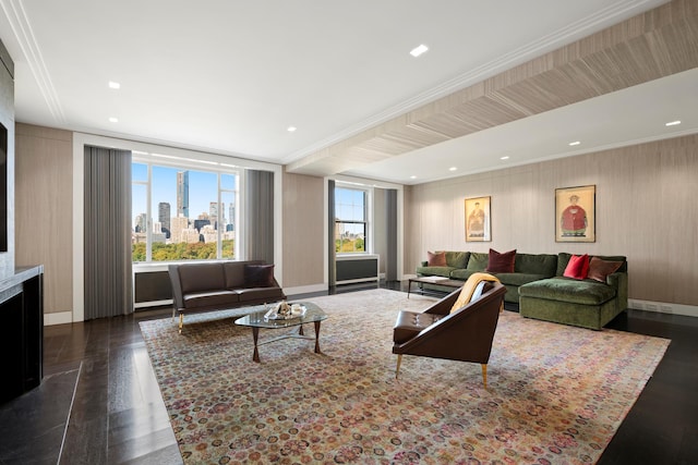 living room featuring dark hardwood / wood-style flooring and ornamental molding