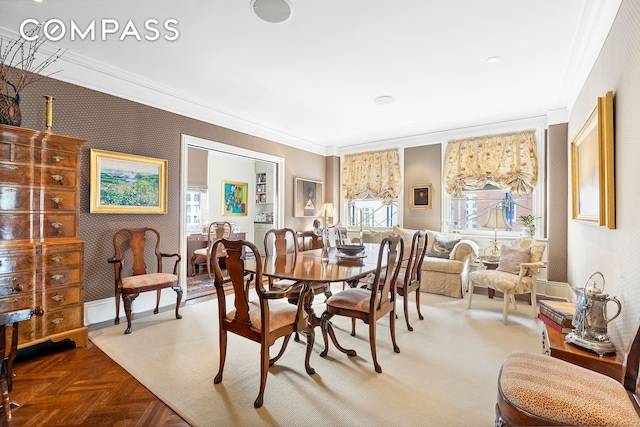 dining area featuring parquet flooring and ornamental molding