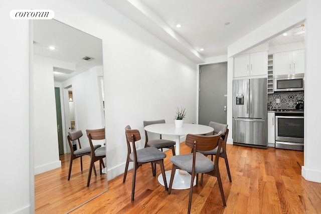 dining area with light hardwood / wood-style floors