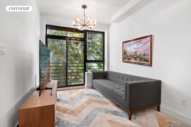 living room featuring an inviting chandelier and plenty of natural light