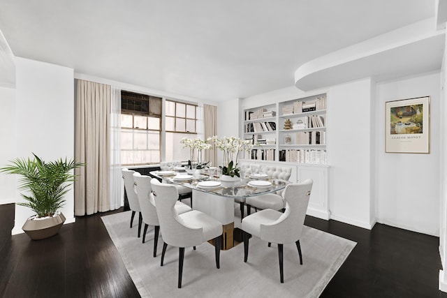 dining area featuring dark hardwood / wood-style flooring