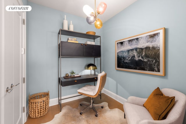 office space with a chandelier and hardwood / wood-style flooring