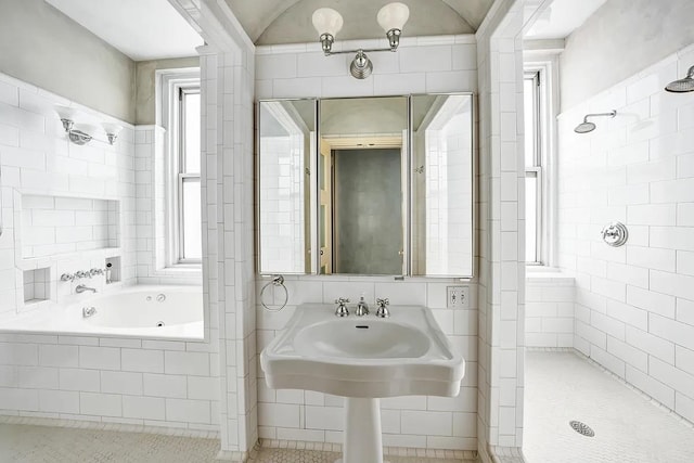 bathroom featuring tile walls and plus walk in shower