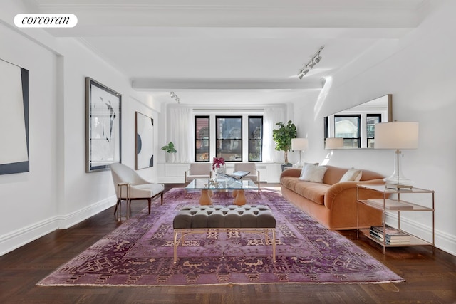 living room with wood-type flooring, ornamental molding, and a healthy amount of sunlight